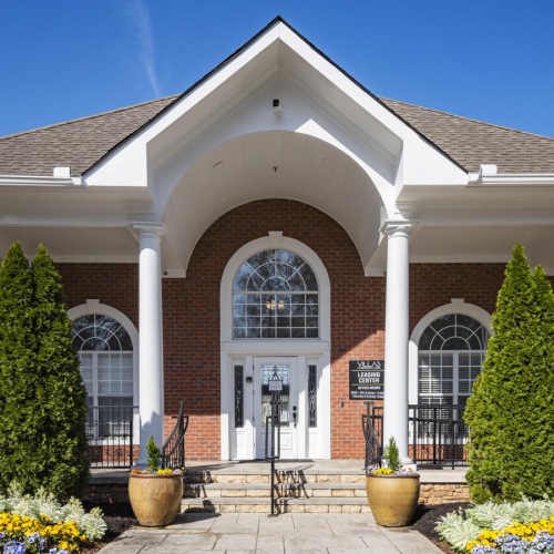 a brick building with a large front entrance